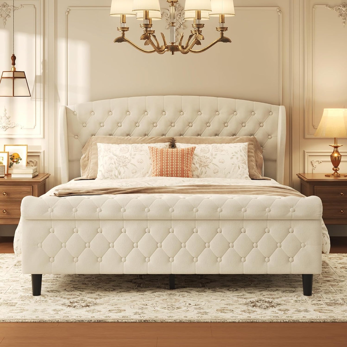 Frontal view of the wingback tufted headboard and diamond-pattern footboard on a light beige velvet bed