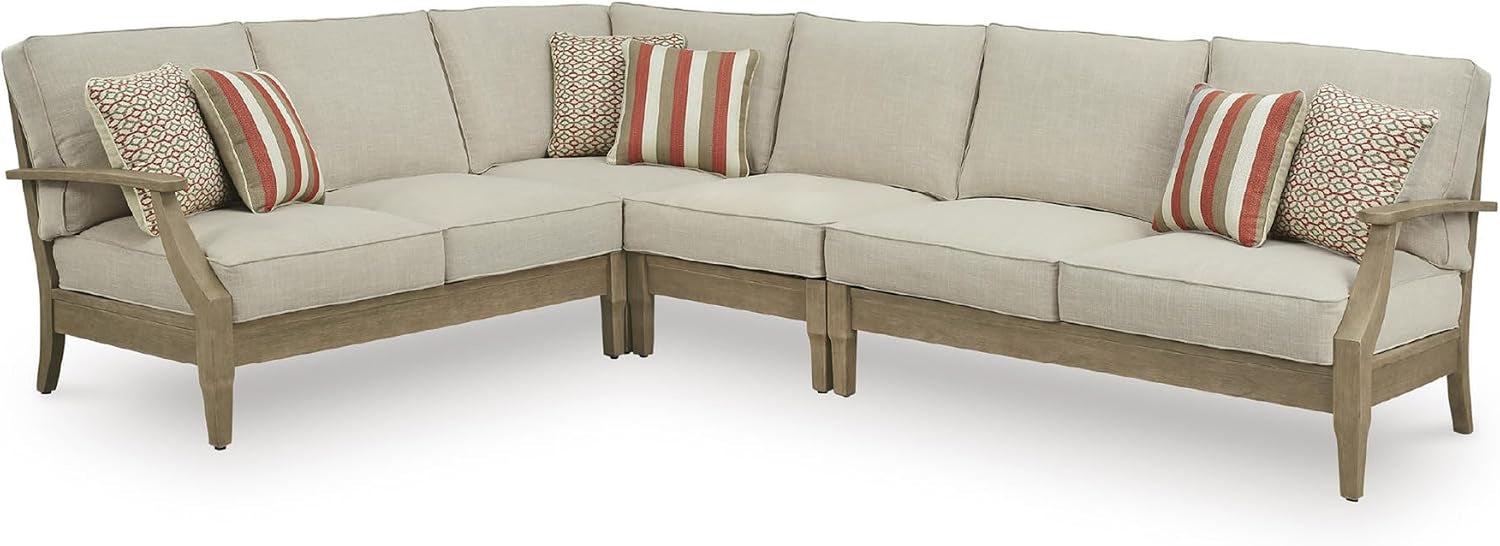 Large L-shaped sectional configuration with beige cushions and patterned accent pillows
