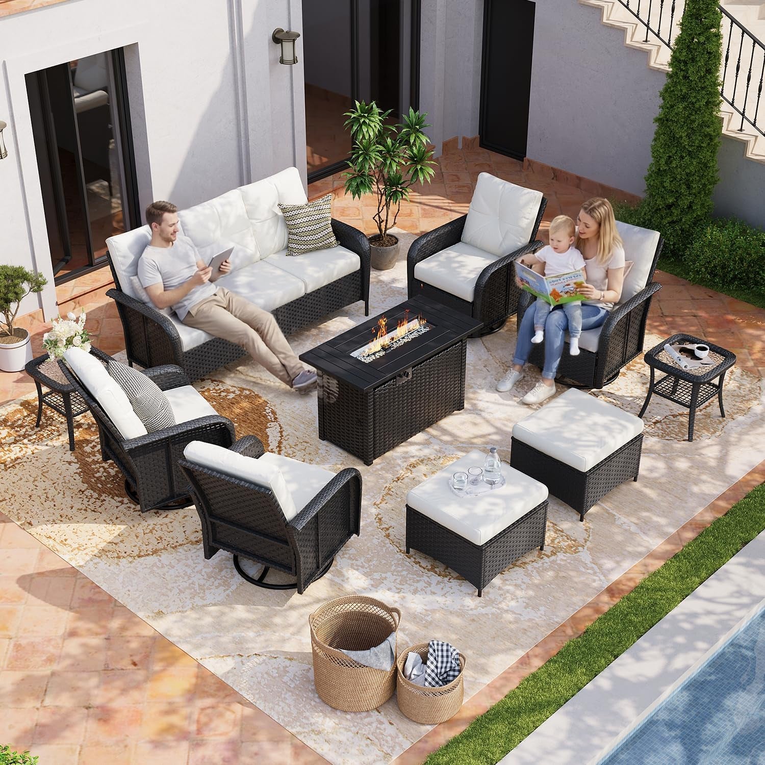 Overhead view of wicker patio set with beige cushions and fire pit table beside a pool