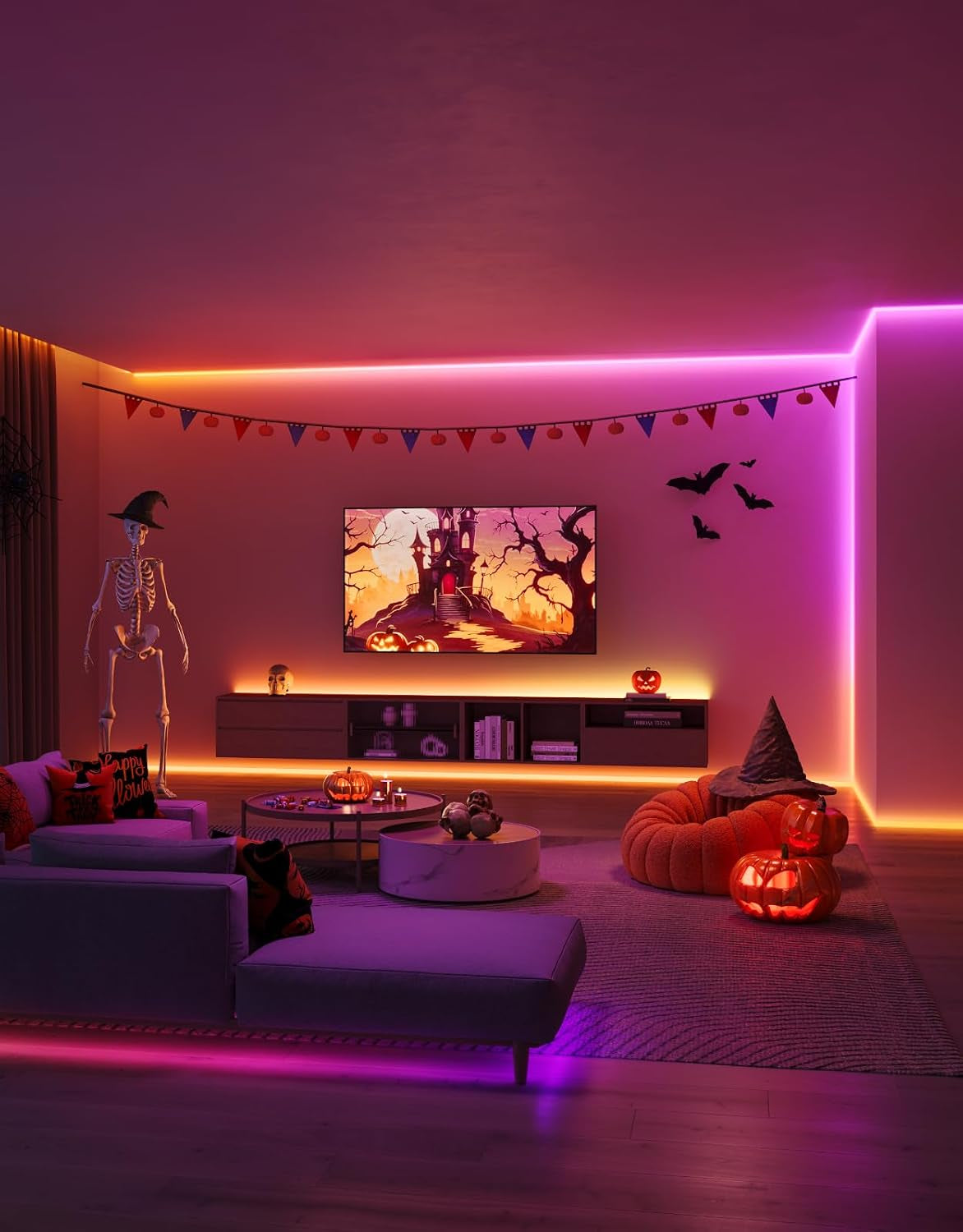 Living room with RGB strip lighting along ceiling and baseboards in purple and orange tones with party decor