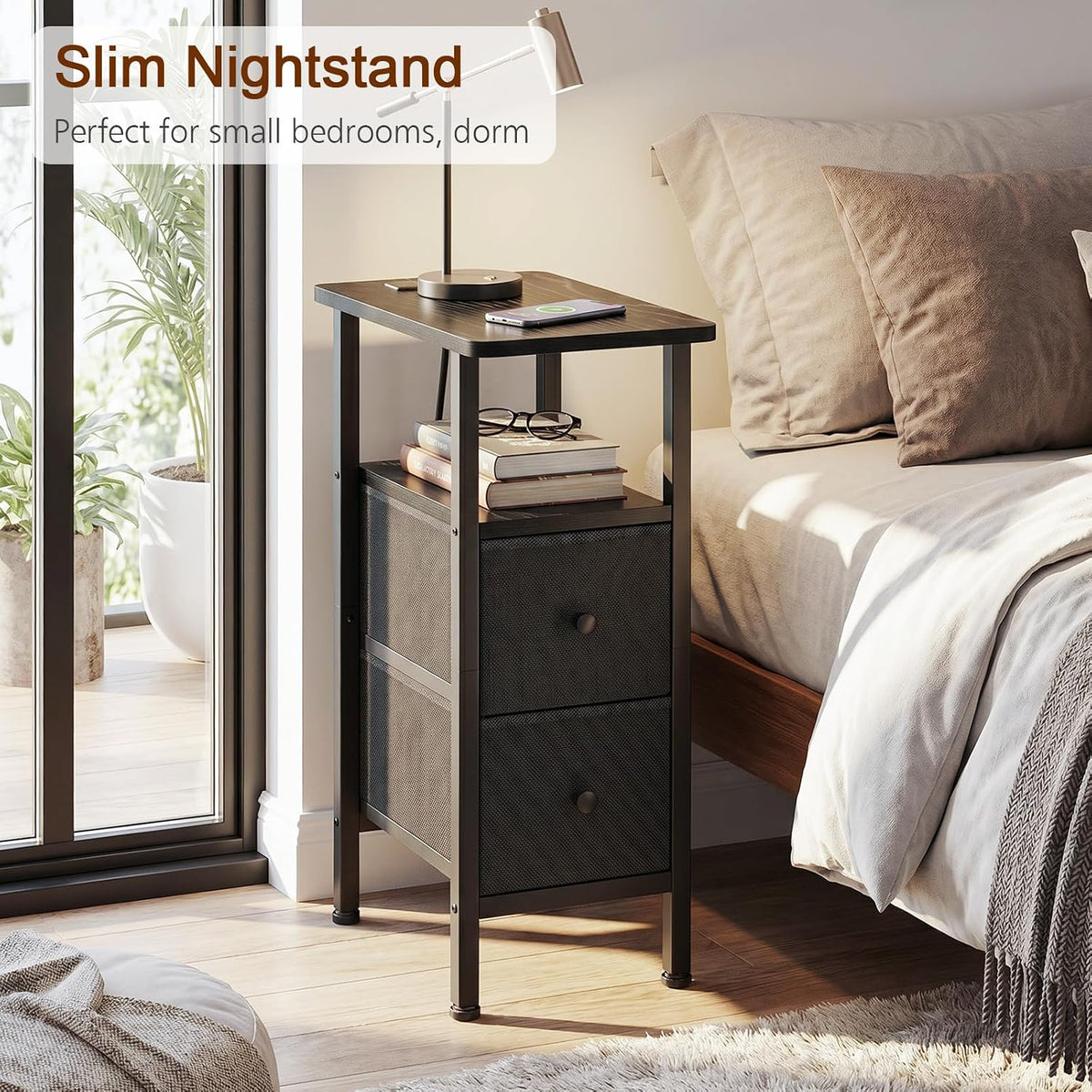 Black slim nightstand with two drawers and books on middle shelf beside a bed