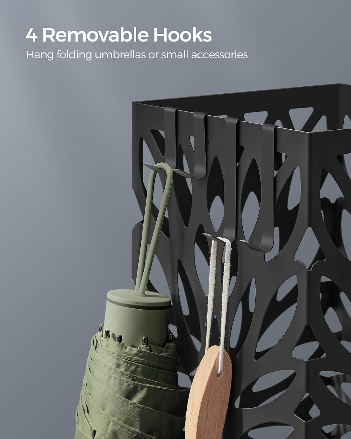 Detail showing four removable side hooks on the black stand holding a folded umbrella and wooden accessory