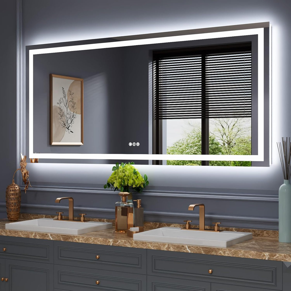 Large horizontal mirror with bright inner LED strip and soft backlight above a grey vanity with two sinks and bronze faucets.