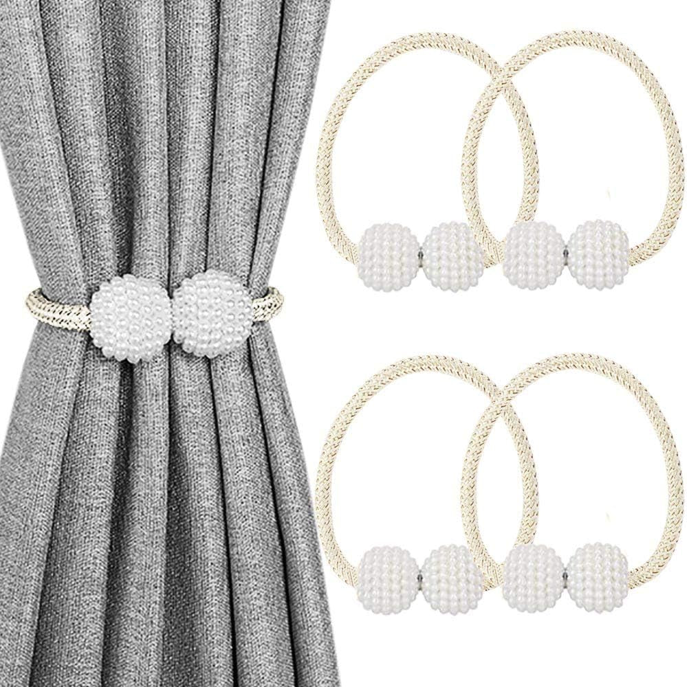 Gray curtain gathered with a cream braided magnetic tieback featuring two white textured pearl balls; two matching loops