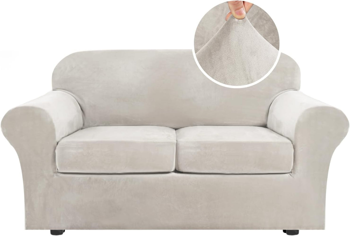 Front view of a beige two-cushion sofa covered in a plush stretch slipcover with circular fabric close-up.