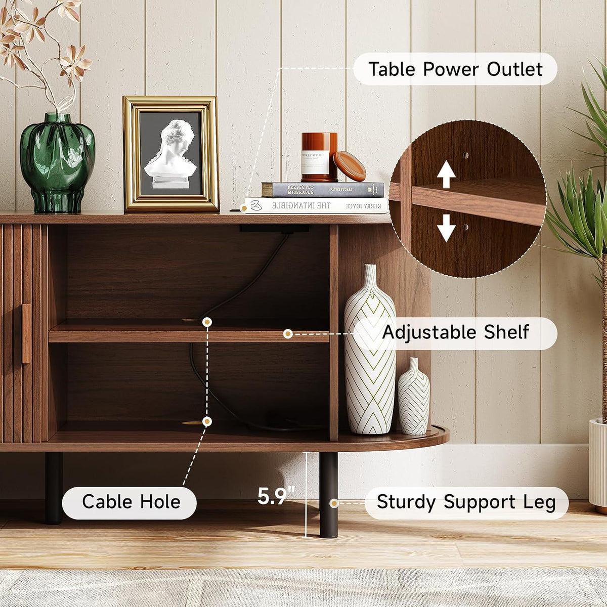 Close-up interior view showing adjustable shelf peg holes, a cable hole and a sturdy black support leg beneath the shelf