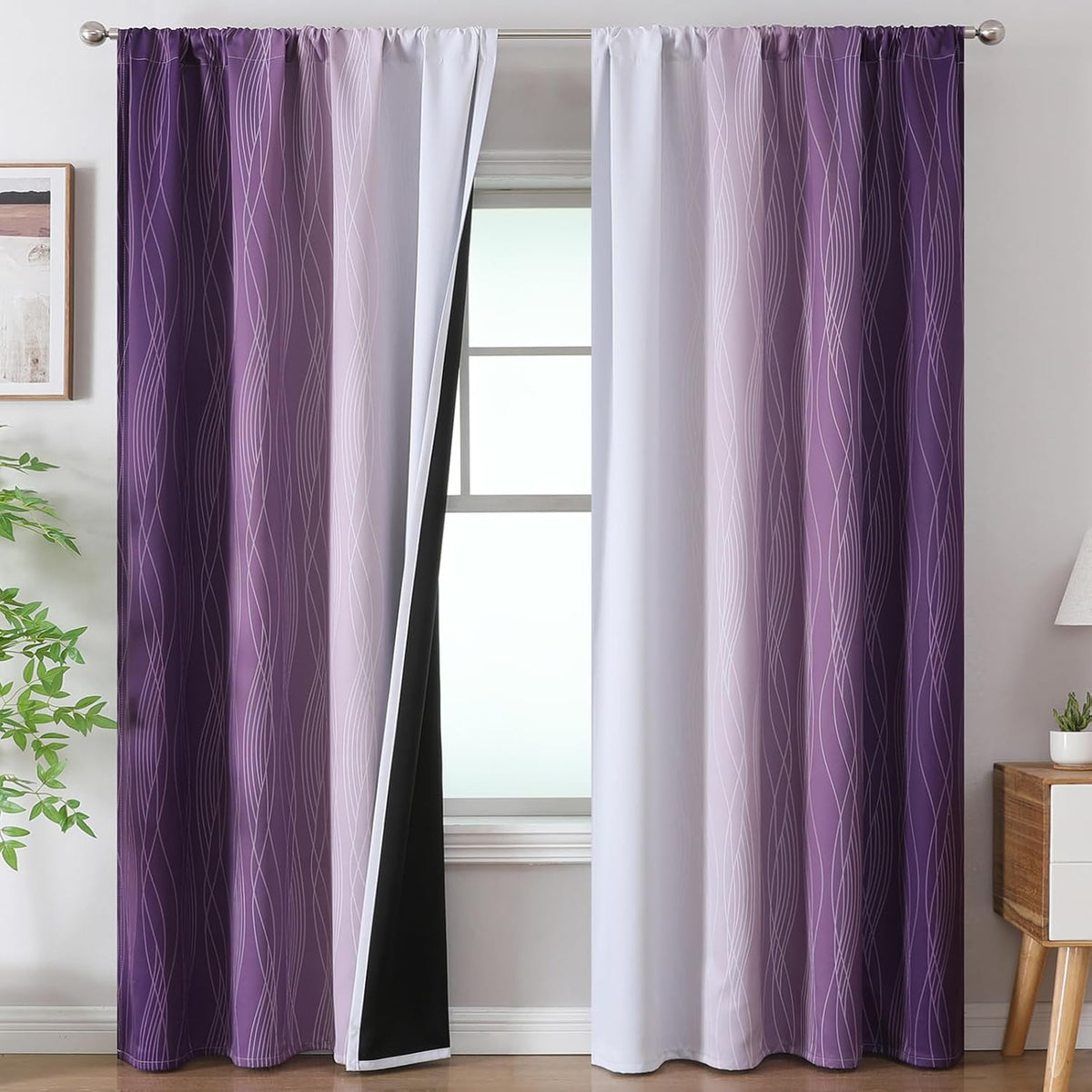 Window with purple-to-lilac ombre curtains, white inner panel visible and one side pulled back to show black lining