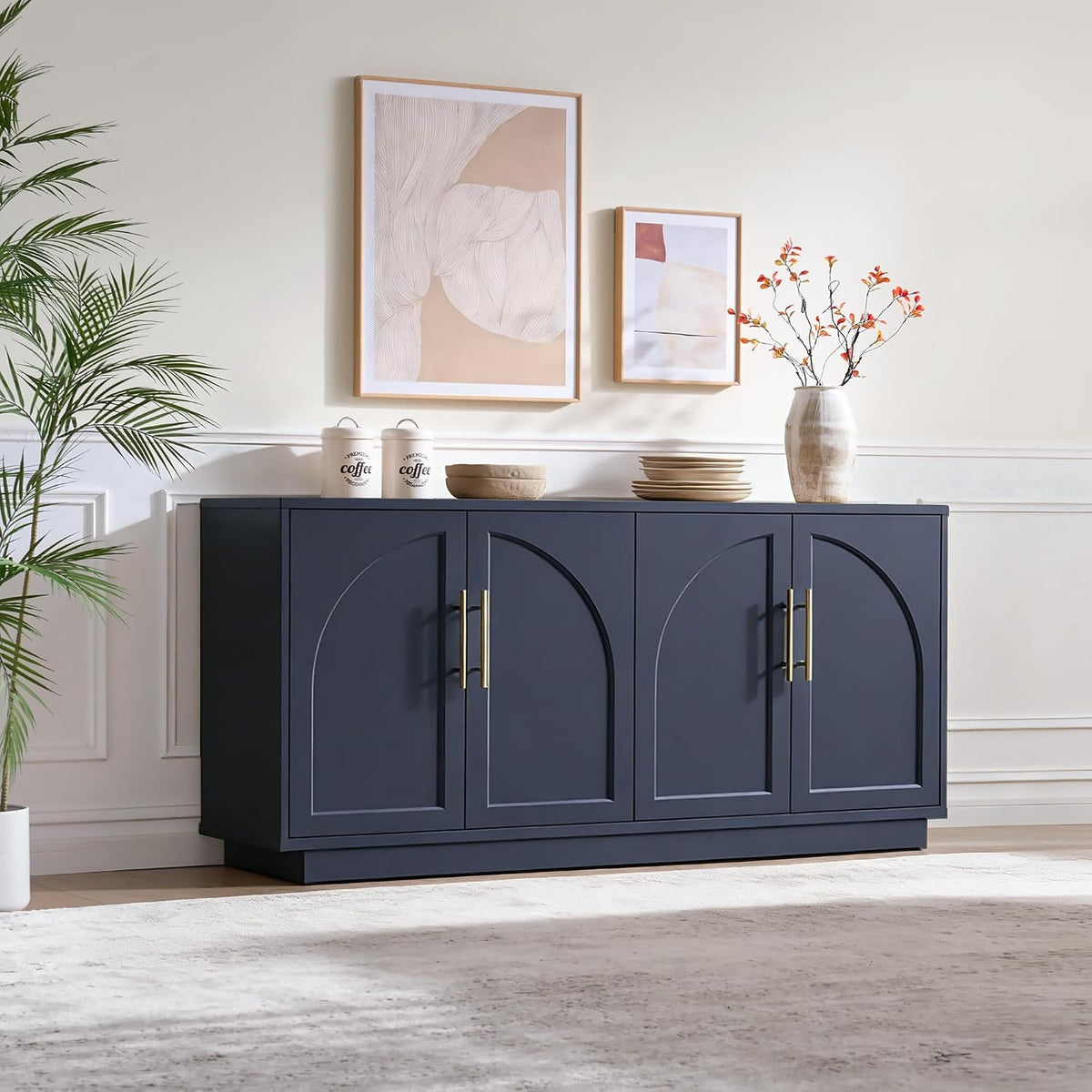 Dark blue four-door buffet with arched door panels styled in a bright living room vignette