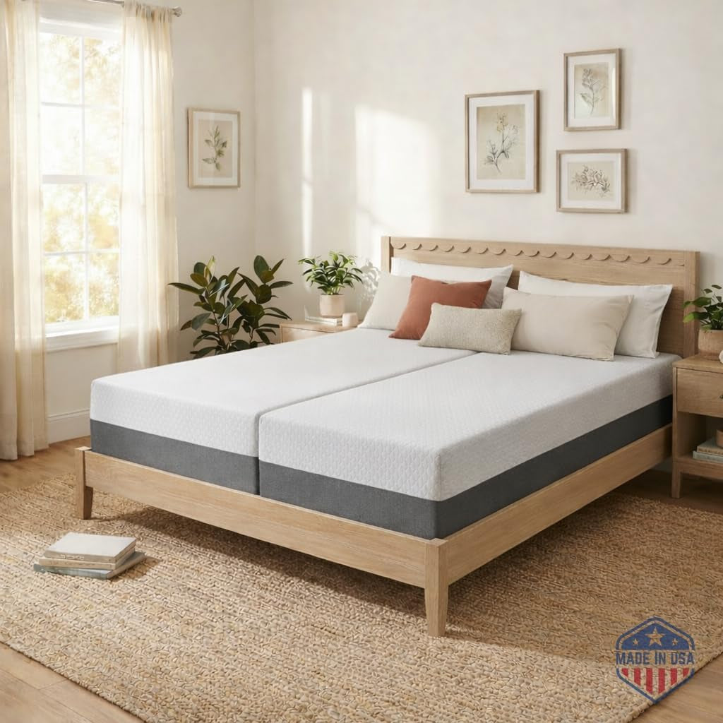 Two matching gray-top mattress halves on a wood bed frame in a bright bedroom, front angle
