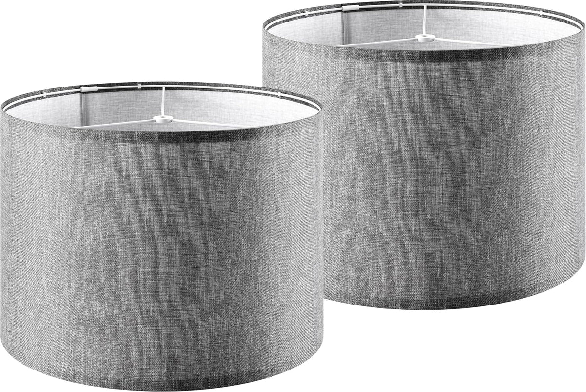 Two gray drum lamp shades shown side by side, angled to reveal the interior fitter.