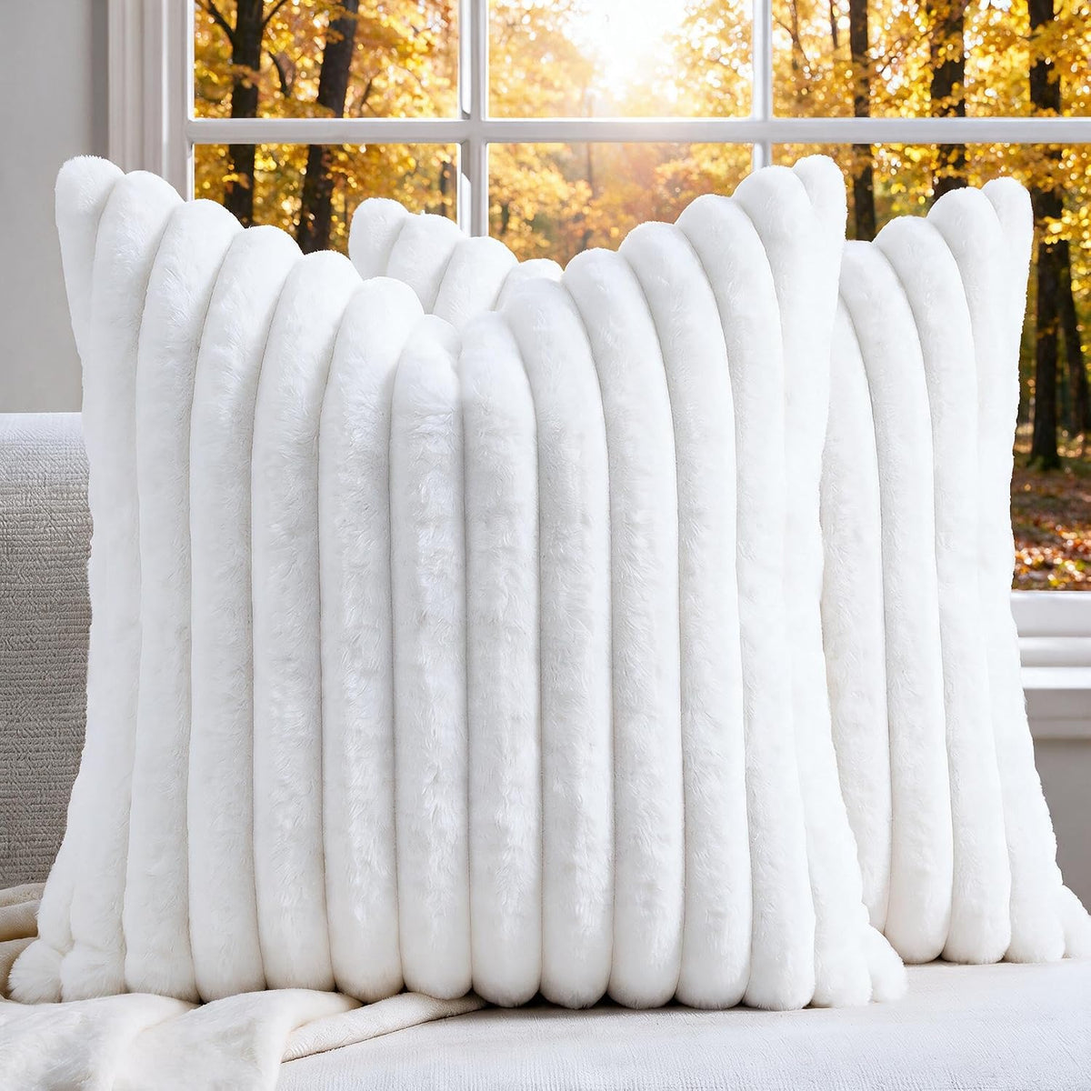 Close-up front view of a white faux fur ribbed pillow cover showing thick vertical plush ribs