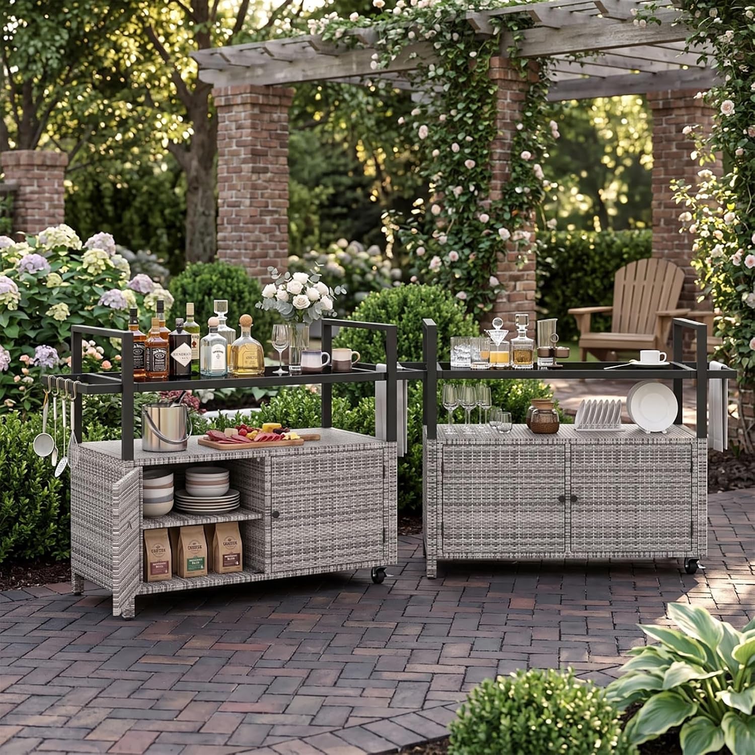 Two gradient gray rattan rolling bar carts with tempered glass tops staged on a brick patio with garden pergola