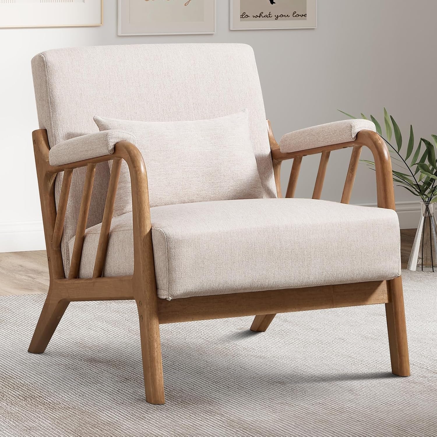 Close-up of a light beige fabric chair showing curved wooden arm slats and tapered legs.