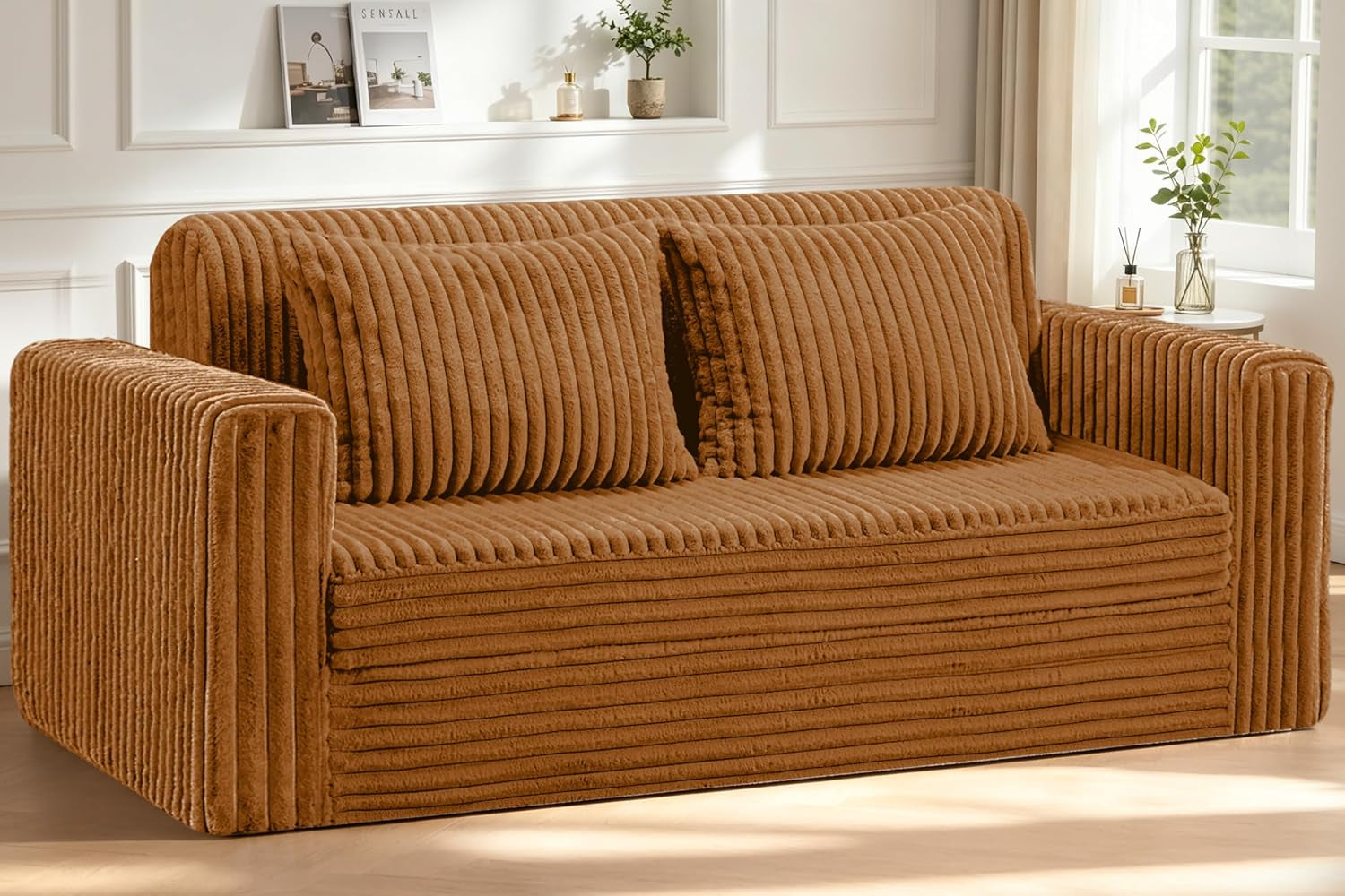 Angled side-front view of the brown ribbed loveseat with armrests and two large back cushions.