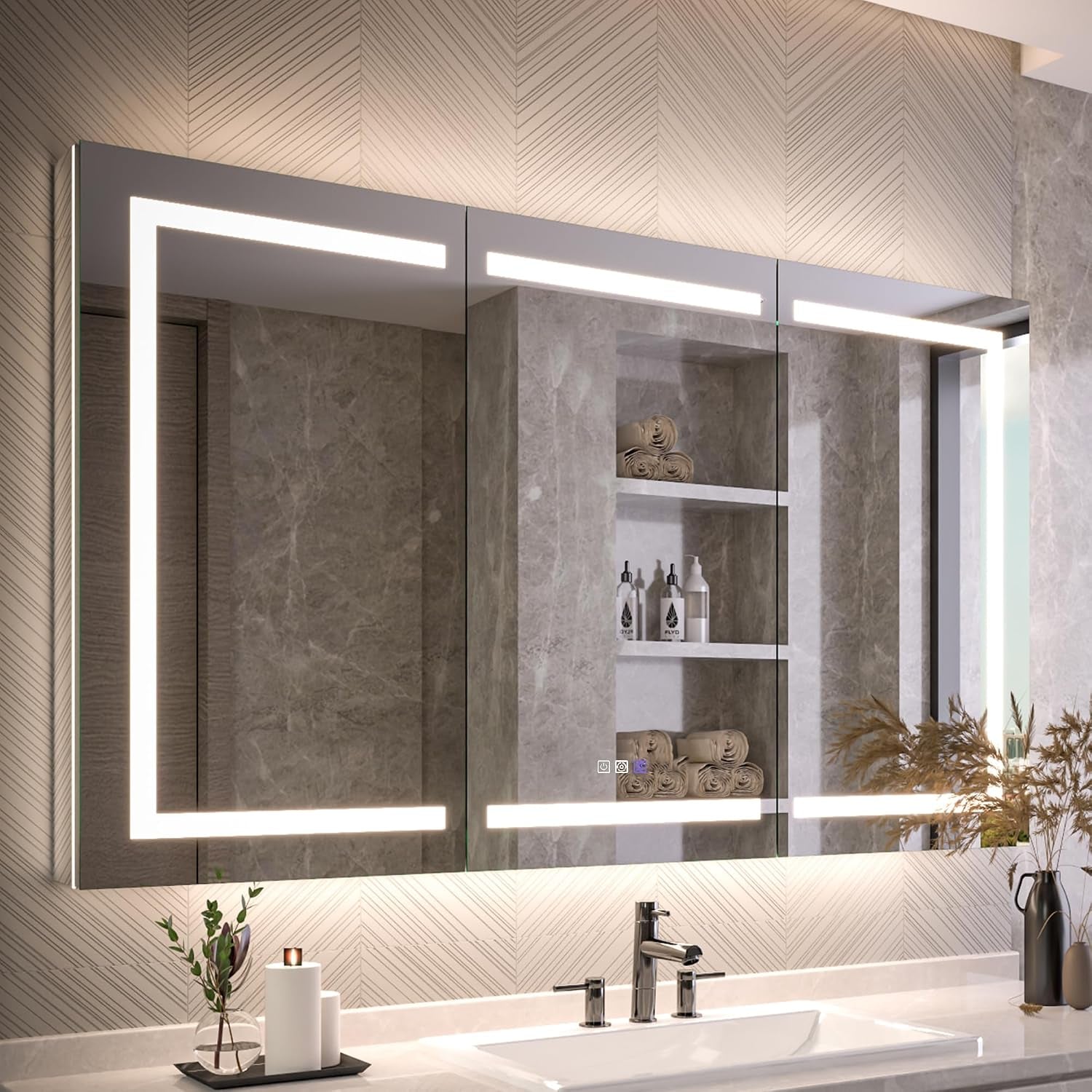 Wide bathroom shot of a three-door mirrored medicine cabinet with illuminated rectangular LED border above a sink.