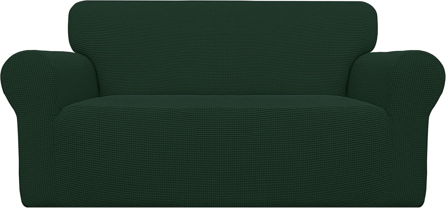 Front view of a loveseat covered in a deep forest-green textured stretch slipcover.