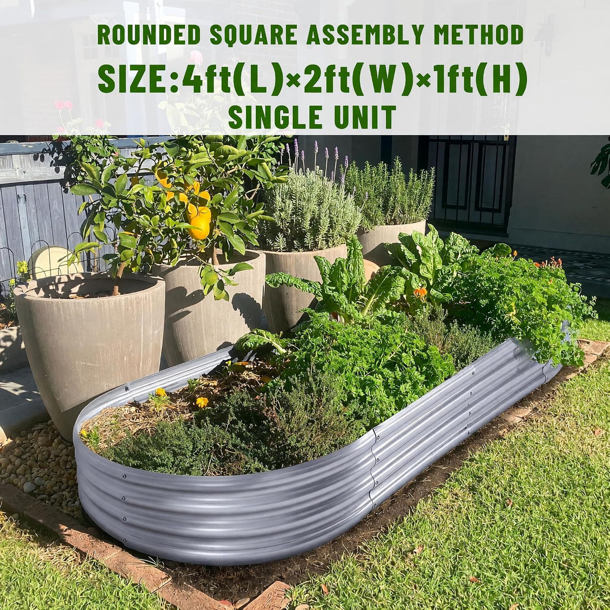 Grey galvanized oval raised bed installed outdoors with herbs and large potted plants, angled top view