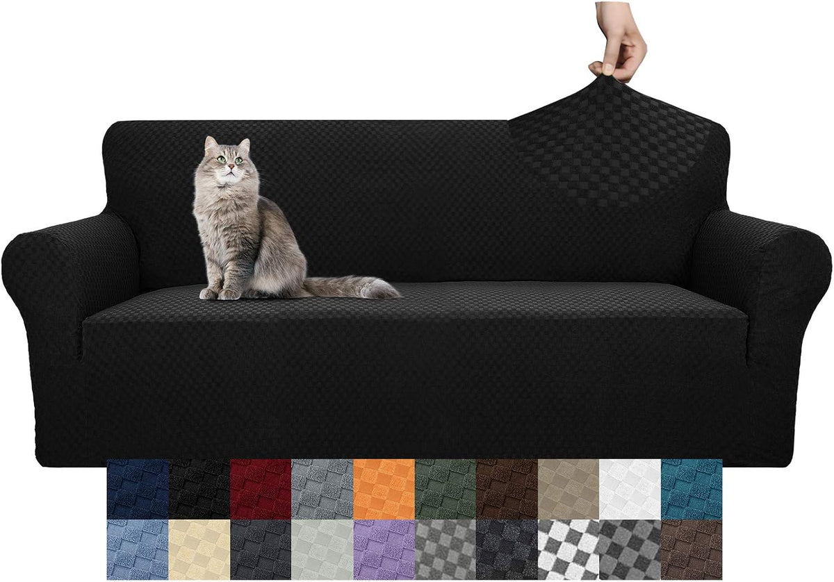 Black textured sofa cover pulled over a couch with a cat seated on it and a row of color swatches below