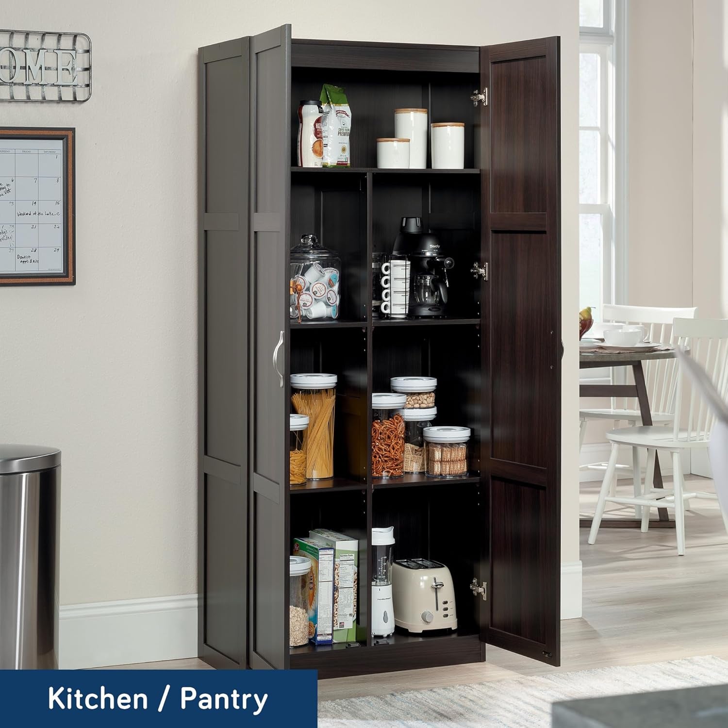 Open two-door cabinet showing multiple shelves filled with pantry jars, boxes and small appliances