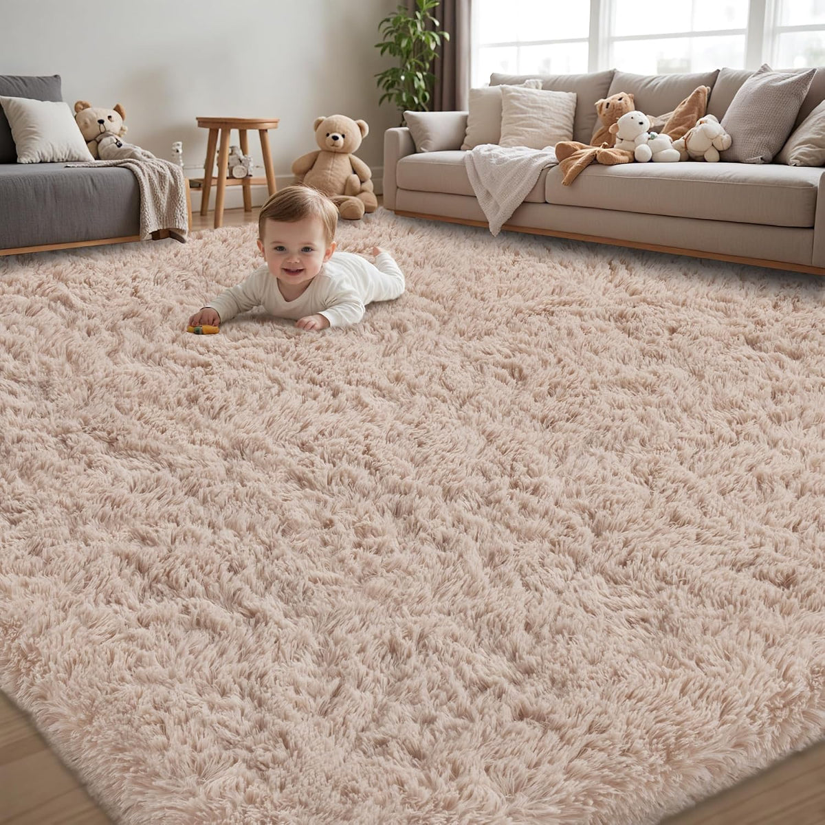 Living room scene with a baby lying on a large fluffy light-pink shag rug in front of sofas.