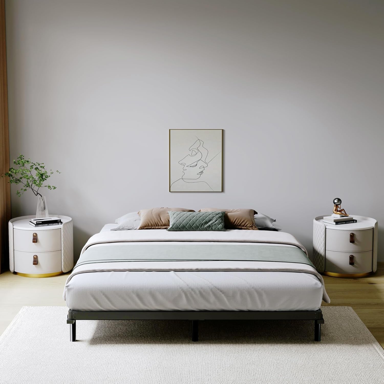 Front-facing bedroom view with a dressed bed; black metal bunkie board edge visible under the mattress at the foot.