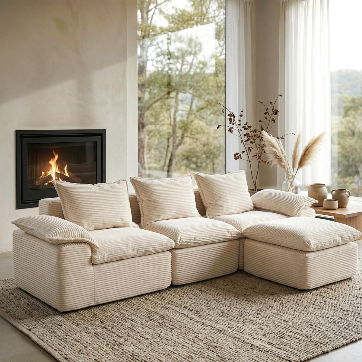 Cream ribbed modular L-shaped sectional sofa staged in a bright living room by a fireplace.