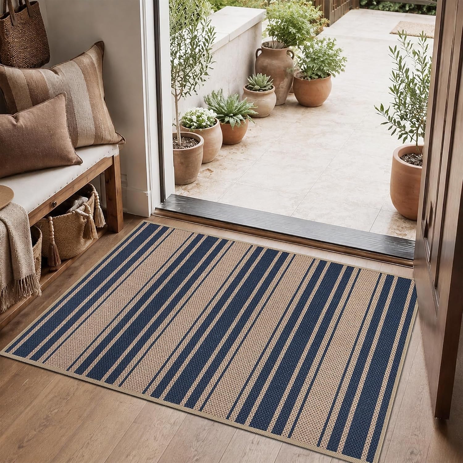 Small rug placed at a doorway with narrow navy and natural vertical stripes.