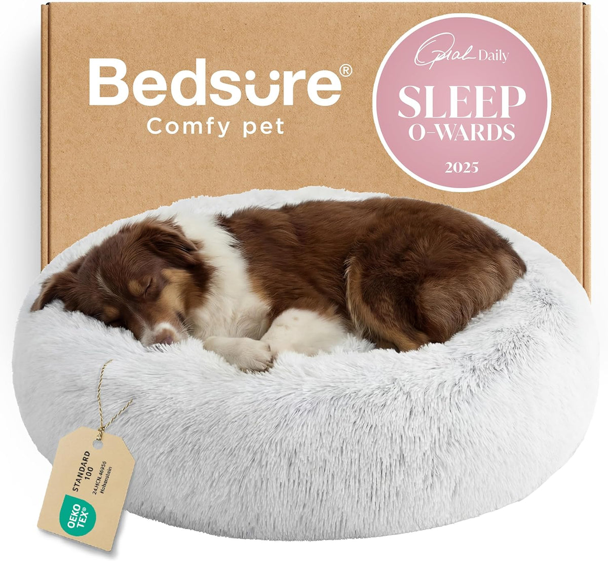 Front view of a light-gray round faux-fur donut bed with a small brown-and-white puppy curled up sleeping