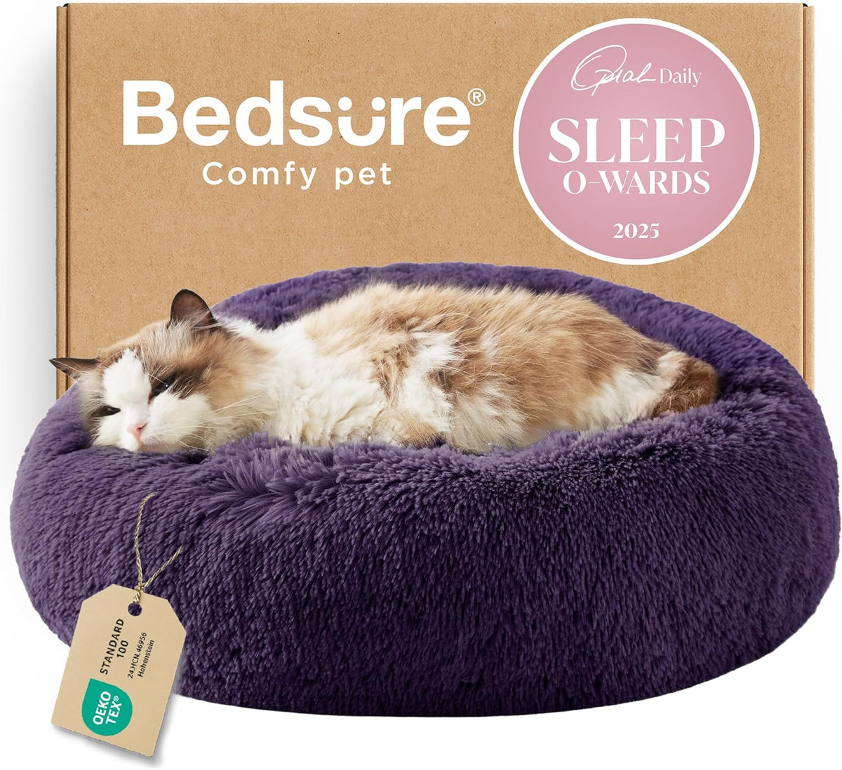 Front view of a deep purple fluffy donut bed with a longhaired cat resting against a cardboard box backdrop
