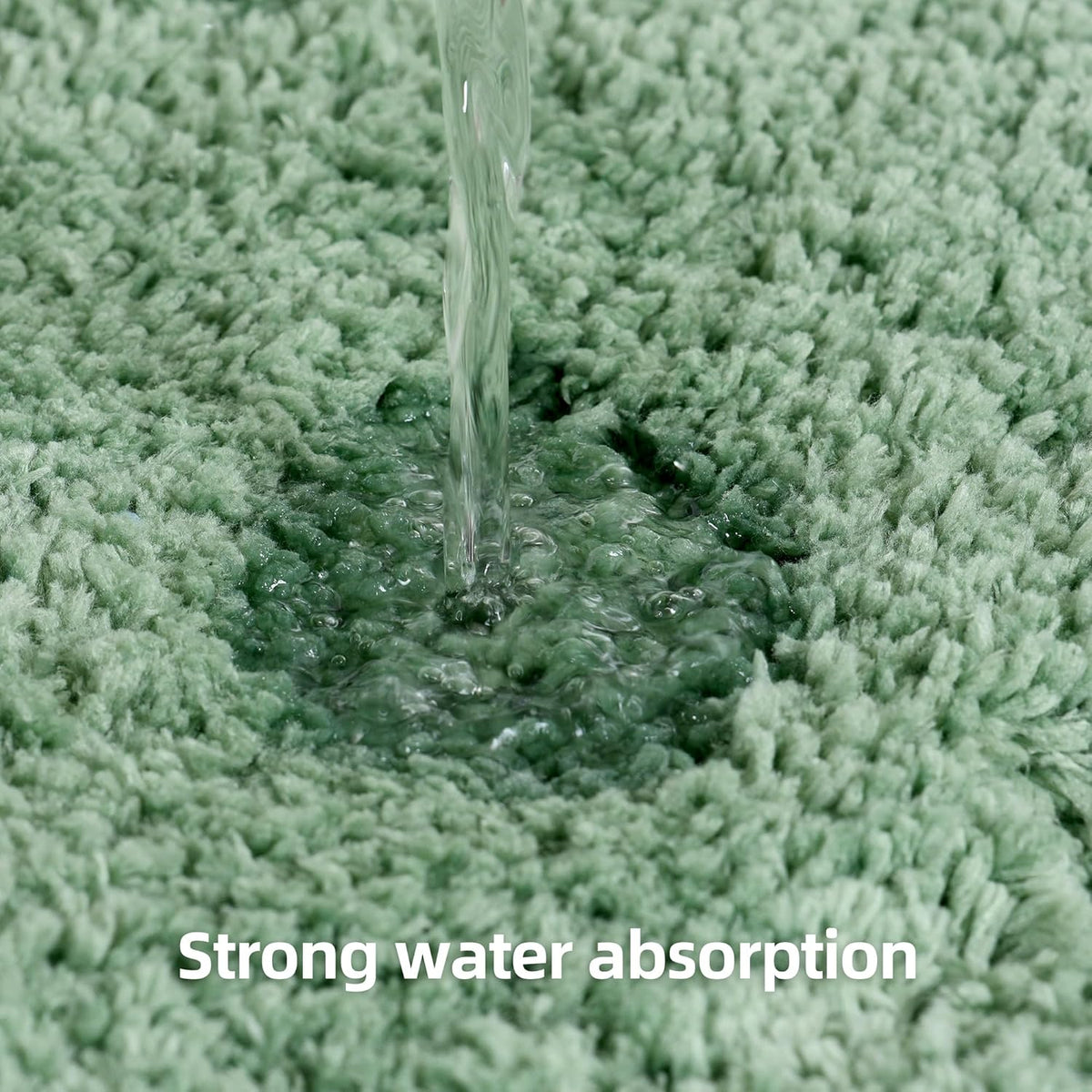 Close-up of leaf-green fluffy rug with water pouring into pile forming a wet spot