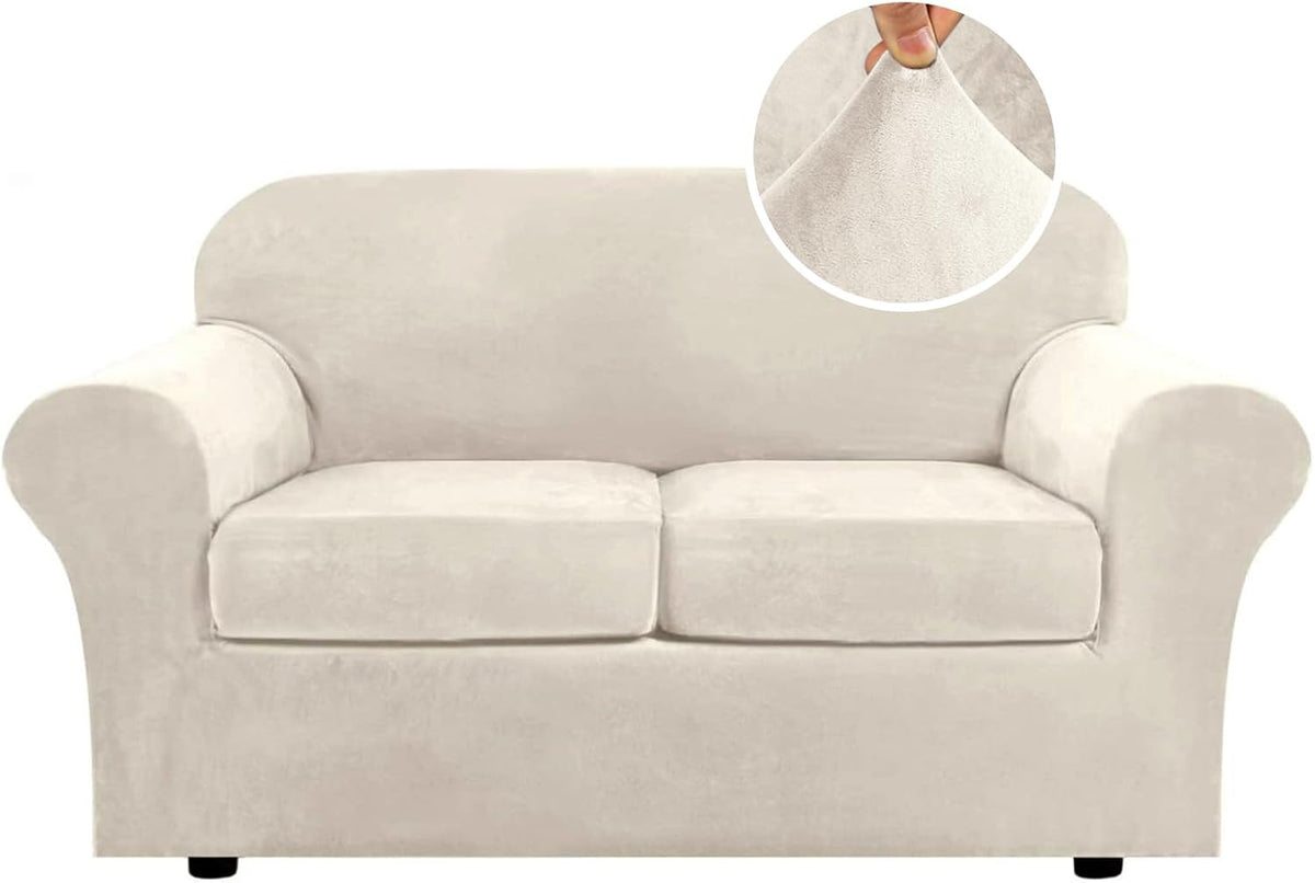 Front view of a two-cushion loveseat covered in a light beige stretch velvet slipcover with round fabric close-up.