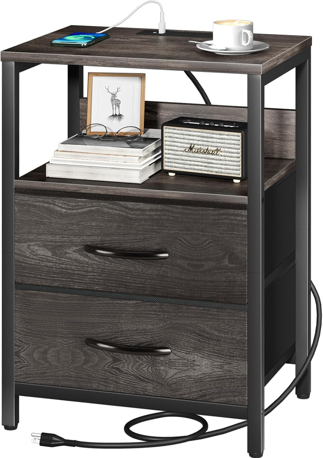 Front view of the nightstand in a darker gray finish with cord coiled at the base and decorative items on the shelf.