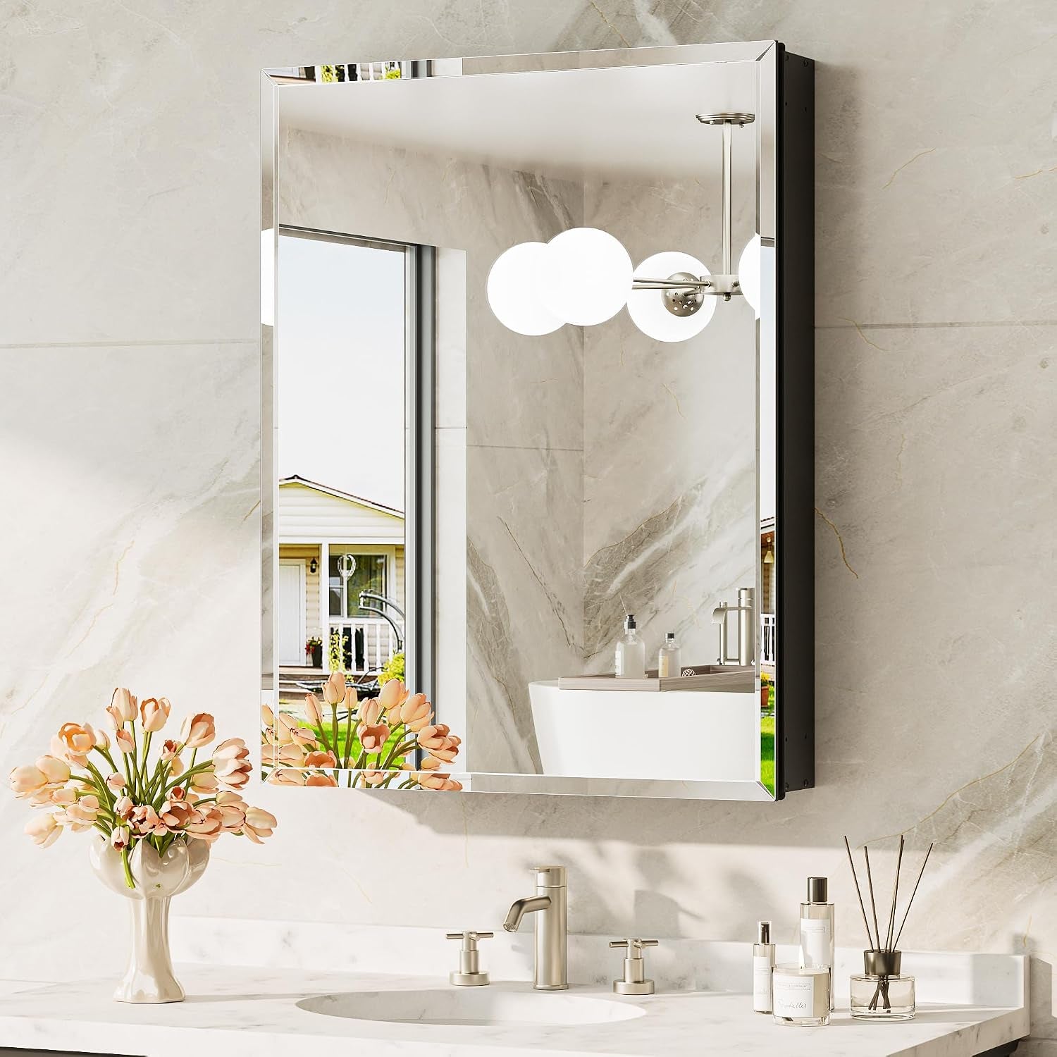 Angled view of one mirrored cabinet showing its silver beveled front and the dark recessed side panel