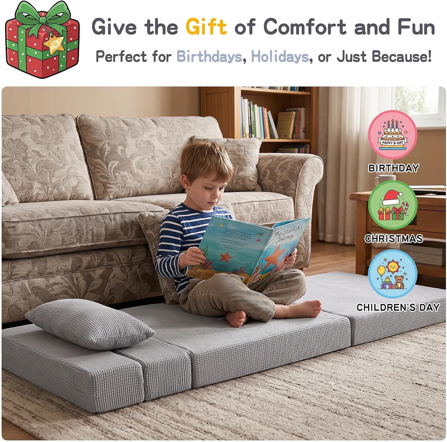 Child sitting cross-legged reading on the gray check mattress on a living room floor with matching pillow and sofa behind.