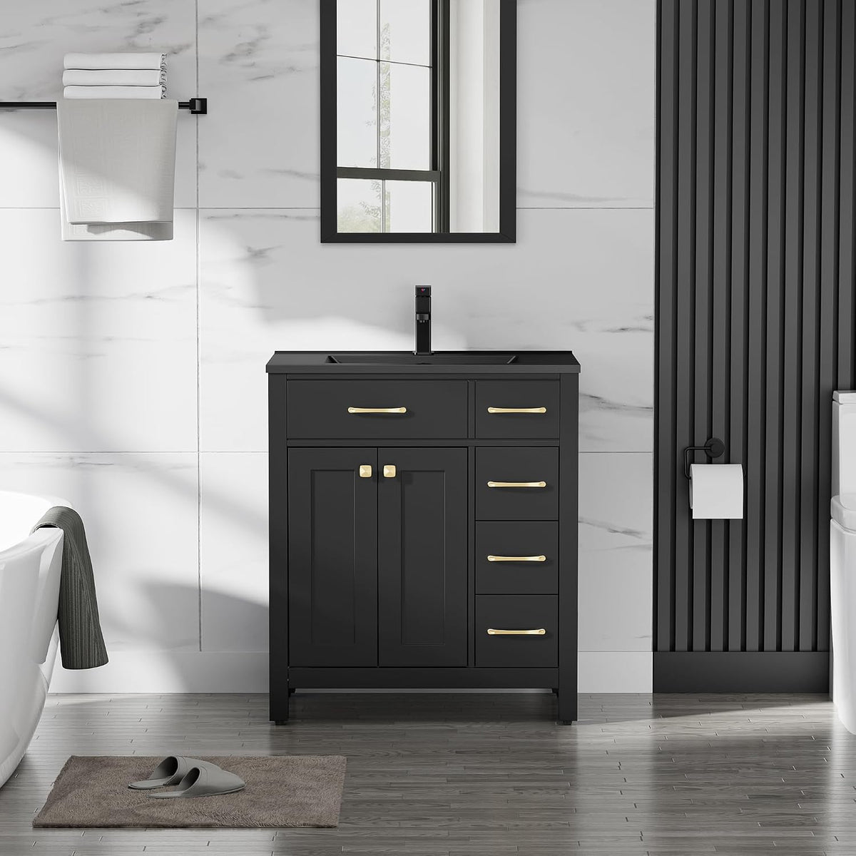 Narrow black single-sink vanity with gold pulls and towel bar at left
