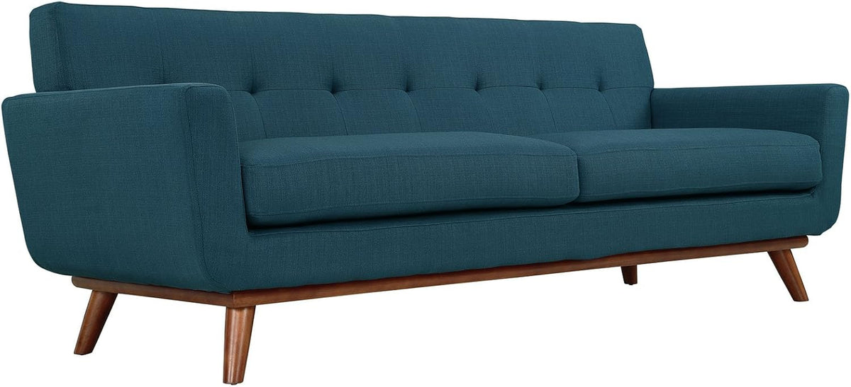 Azure sofa angled front view highlighting splayed wood legs and tufted back