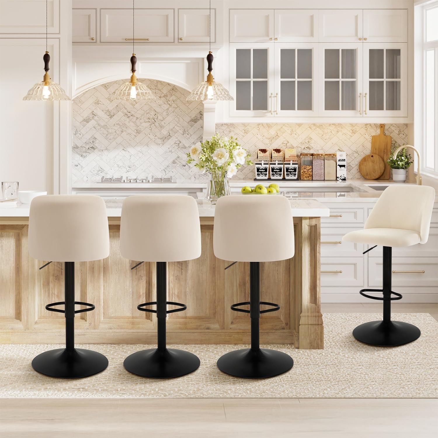 Back view of three cream bar stools at an island and a fourth stool angled to the right showing seat profile.