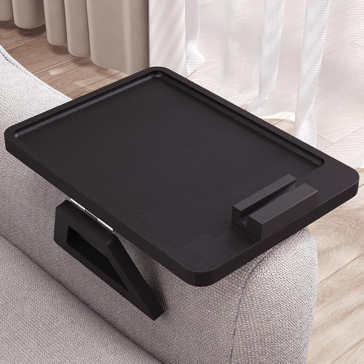 Black finish arm tray shown from top with a small rectangular phone stand on rim