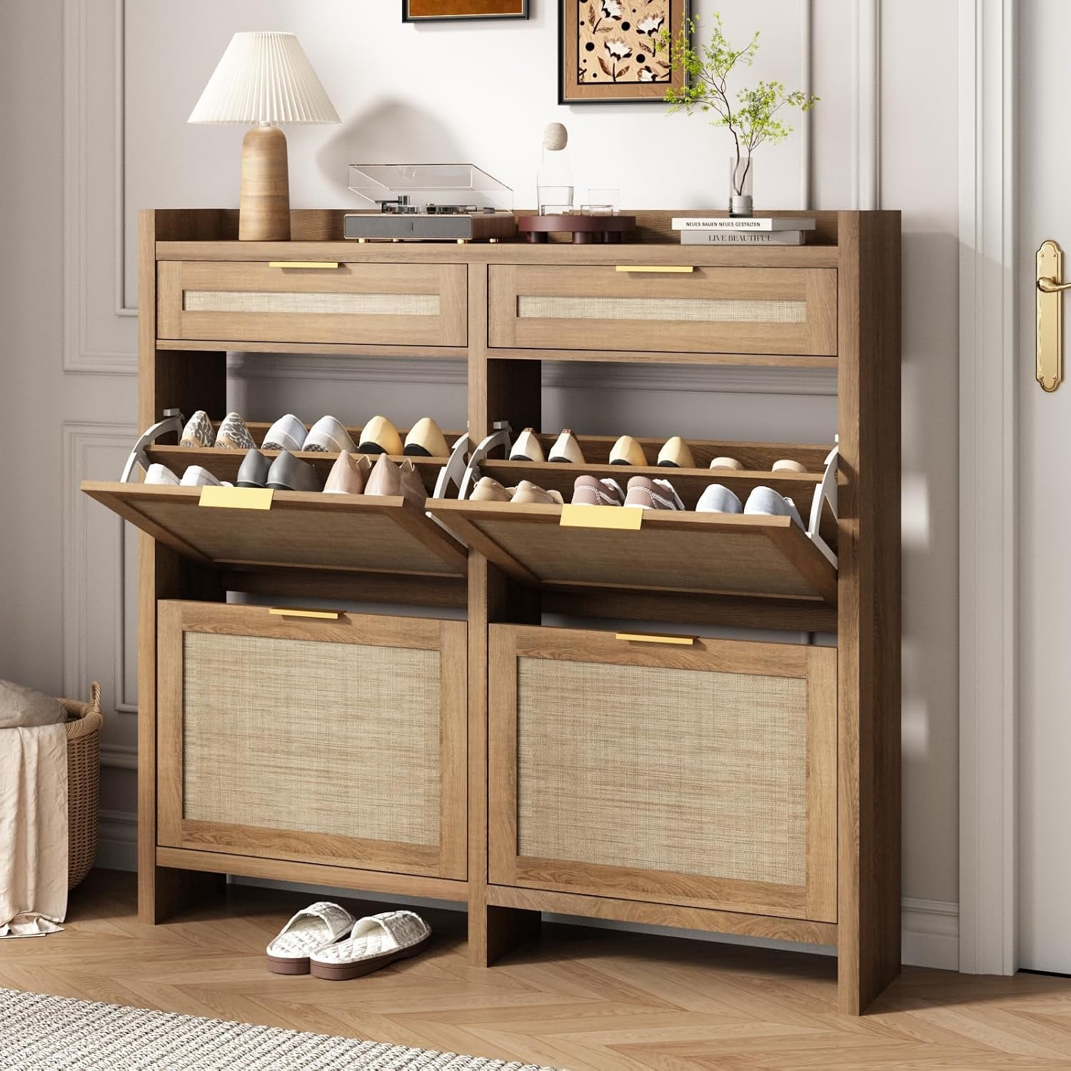 Rustic oak shoe cabinet with lower flip drawers open revealing shoes, visible wood grain and slippers at the base.