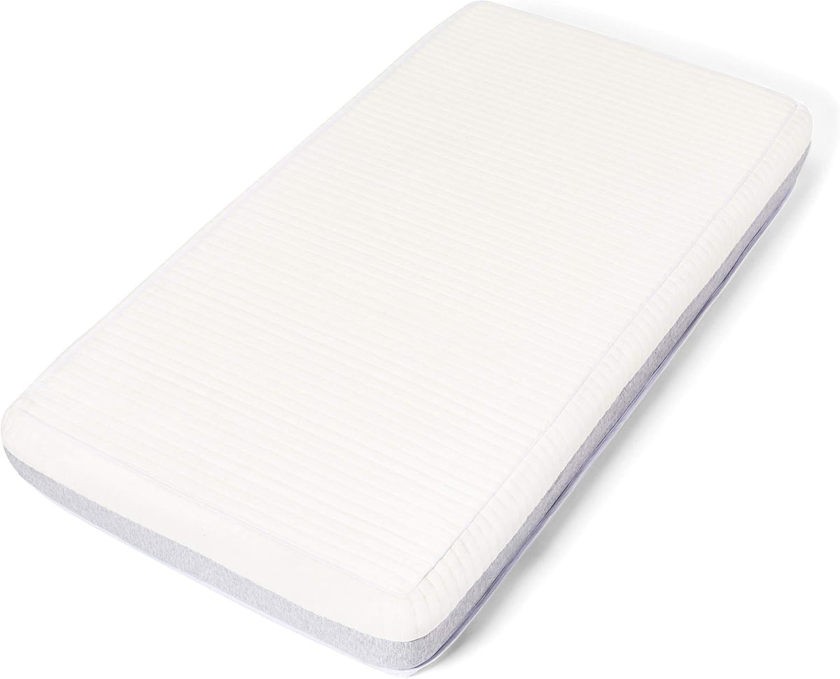Angled full view of the mattress showing ribbed white top and gray side panel