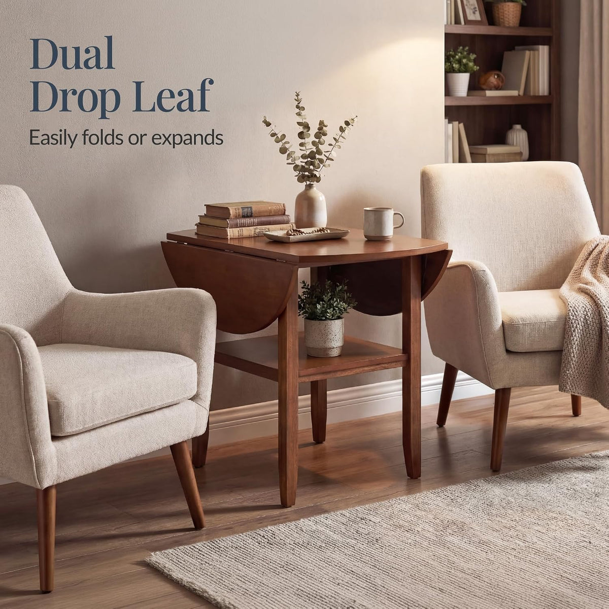 Chestnut table with drop leaves folded between two chairs in a living room