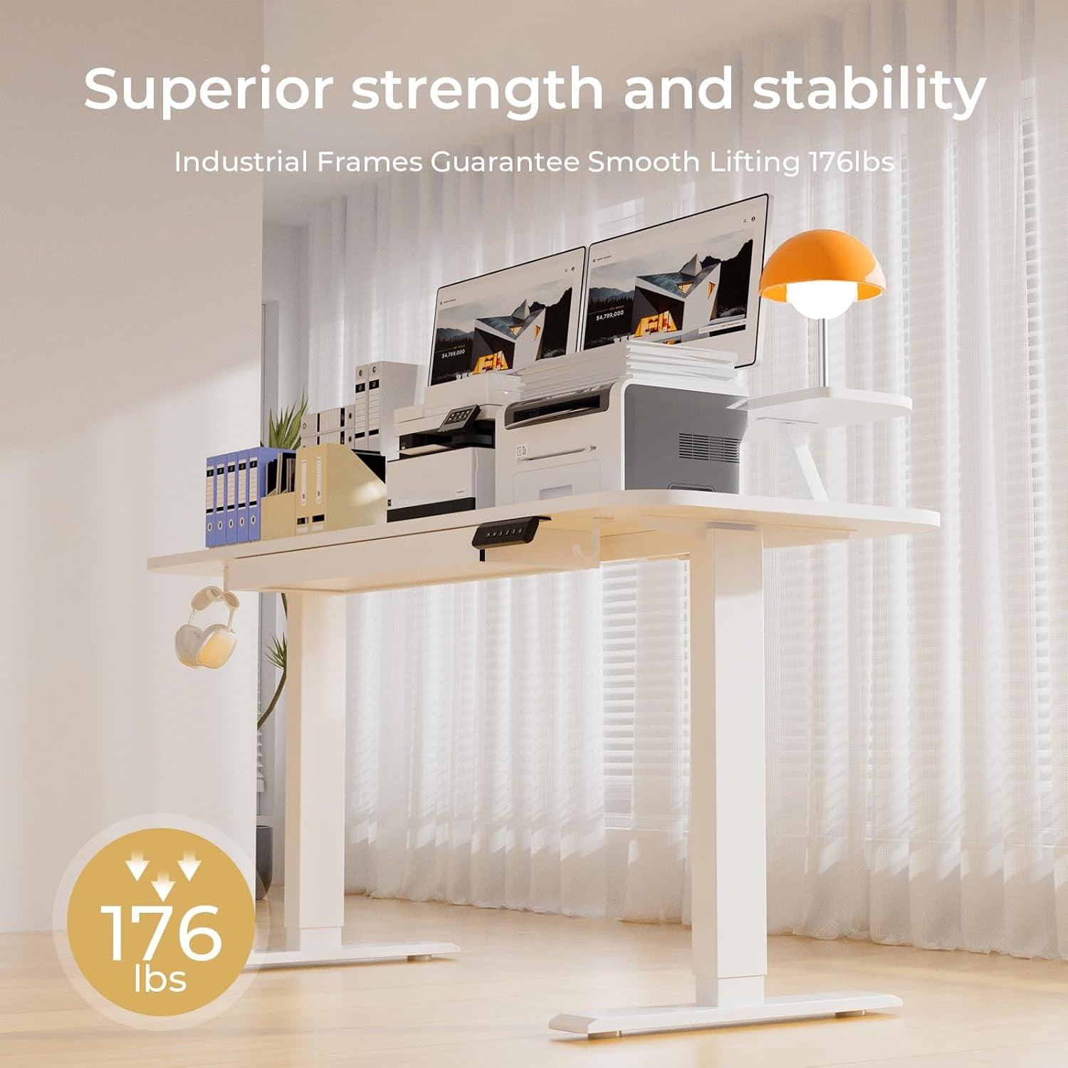 Desk shown at standing height with dual monitors, printer and a hanging headphone hook beneath the tabletop