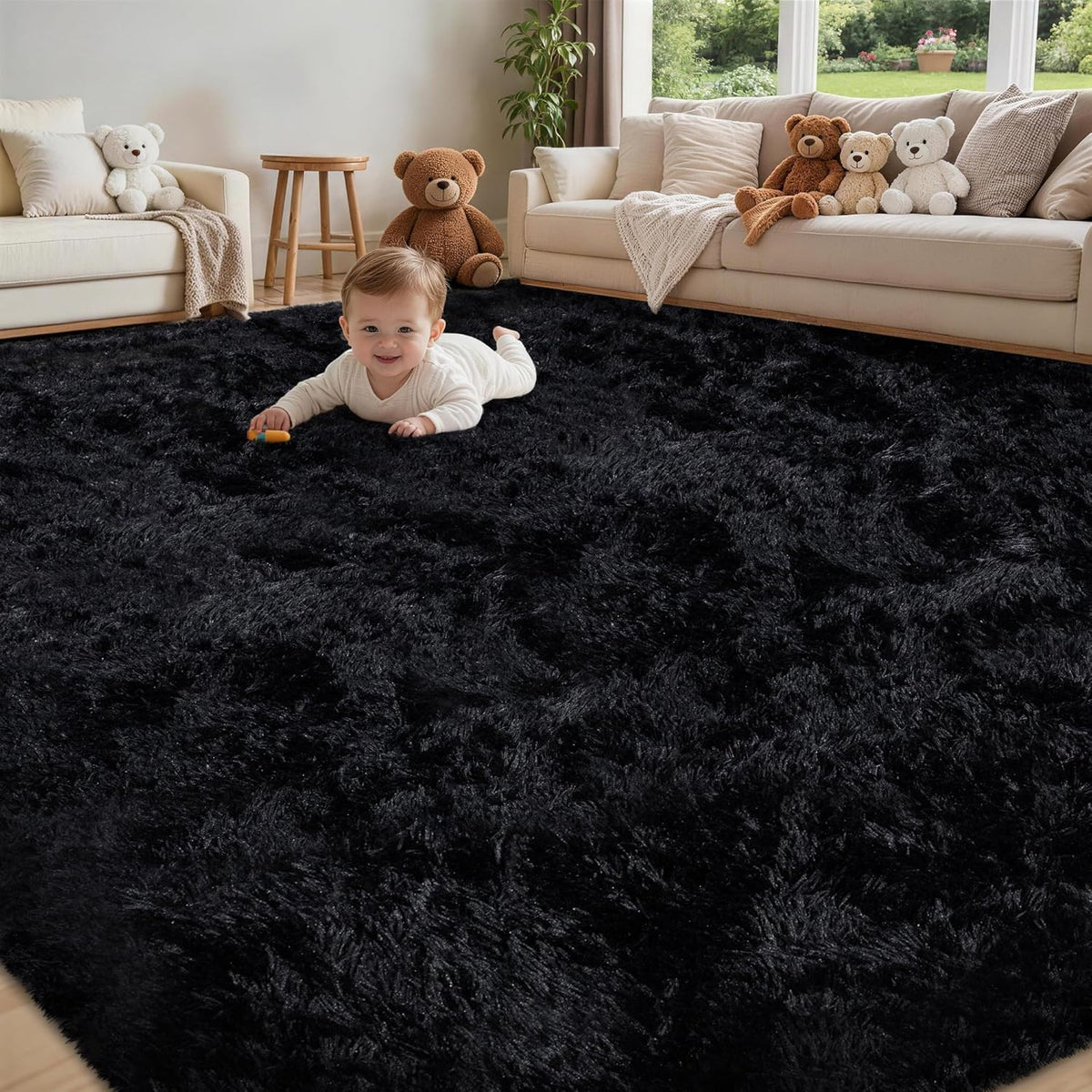 Main room shot of a large black fluffy shag rug with a baby crawling and beige sofas in the background.