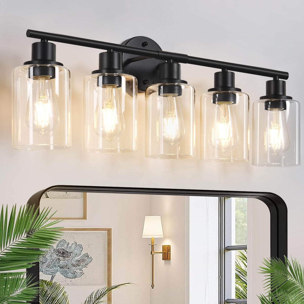 Five-light black vanity fixture with clear glass shades shown mounted above a mirror