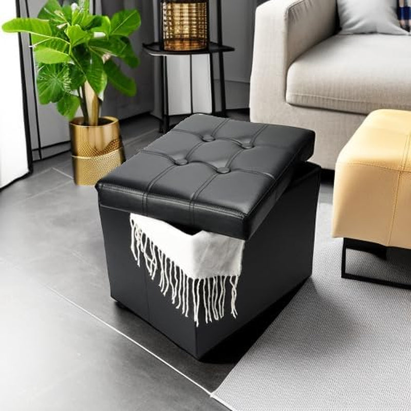 Styled living area with the black storage ottoman shown with its lid slightly raised and a white throw inside, near a plant