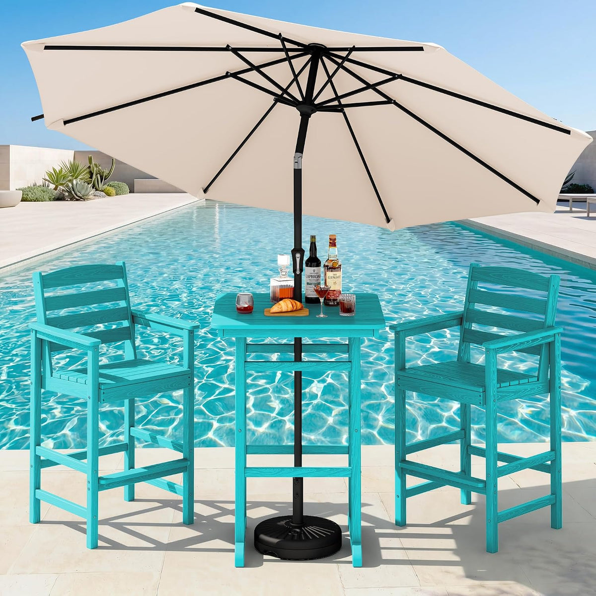 Turquoise two-chair bar set with table and a large beige umbrella beside a pool, drinks on the table.