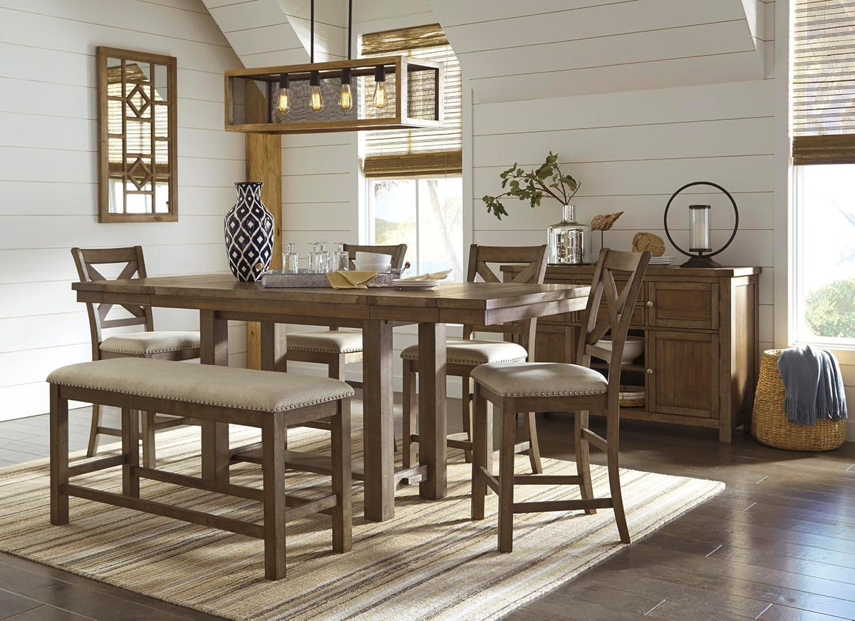 Set of beige upholstered counter stools and matching bench around a distressed nutmeg farmhouse dining table