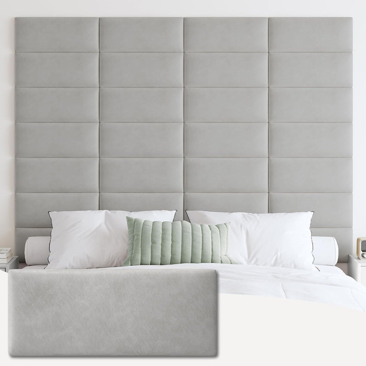 Bedroom shot showing a tall grid of medium-gray tufted rectangular wall panels behind a bed, with a matching panel inset.