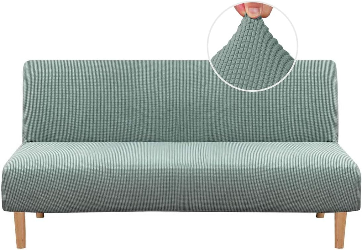 Front view of a slim armless sofa with a light teal small-check textured slipcover