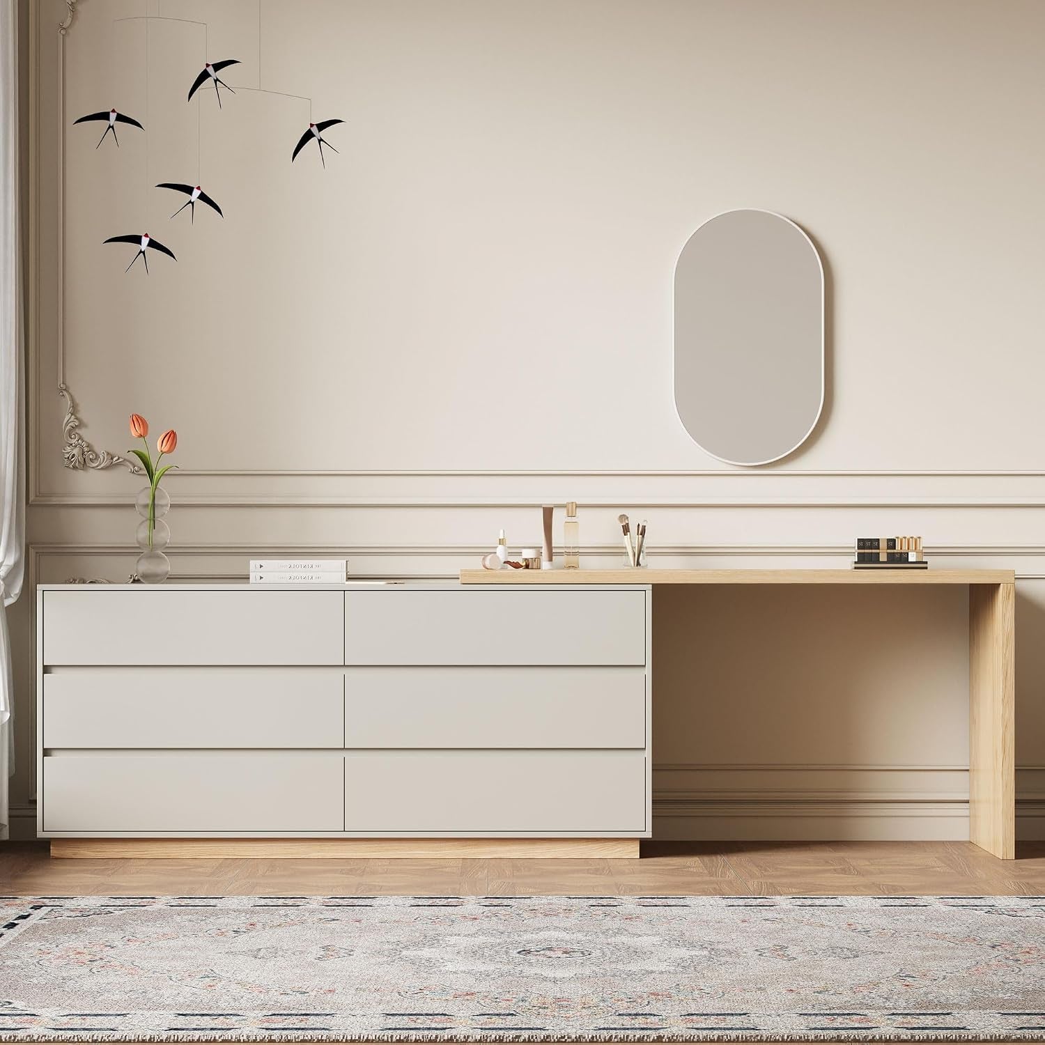 Front view of the light beige dresser with wood tabletop extended as a desk, styled with vase and mirror.